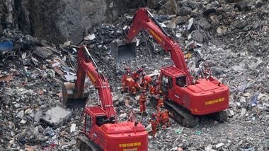 Rescuers at the scene of a landslide in Pengshui County in southwestern China's Chongqing.