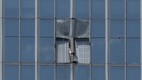 A section damaged after a small plane crashed into it is boarded up at the CITIC Tower, also known as China Zun, the tallest building in Beijing, on Saturday, June 27, 2026. (AP Photo/Ng Han Guan)
