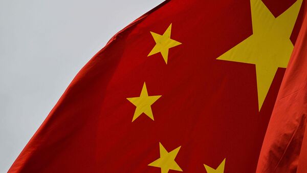 A chinese flag is seen in the financial district of Shanghai on April 7, 2025