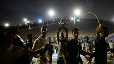 Migrants from Morocco react as they crossed into Ceuta by sea, at the border between the Spanish enclave of Ceuta and Morocco, as seen from Ceuta, Spain, July 30, 2026.