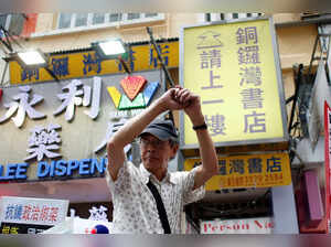FILE PHOTO: Bookseller Lam Wing-kee greets supporters outside his Causeway Bay Books bookstore in Hong Kong