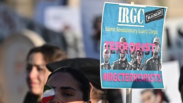 (FILES) Protesters hold placards at a march in central London on January 21, 2023 against the Islamic revolutionary Guard Corps (IRGC) (Photo by JUSTIN TALLIS / AFP)