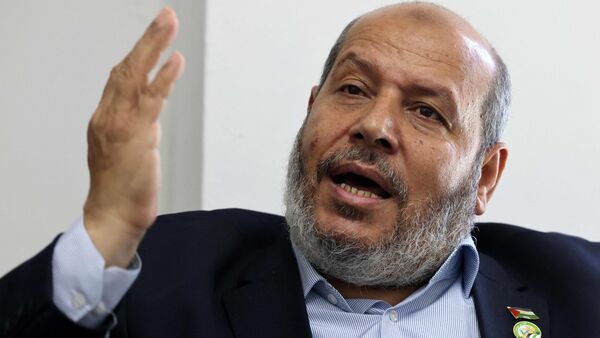 (FILES) Khalil al-Hayya gestures duringan interview with AFP at his office in Gaza City on April 21, 2021. (Photo by Emmanuel DUNAND / AFP)