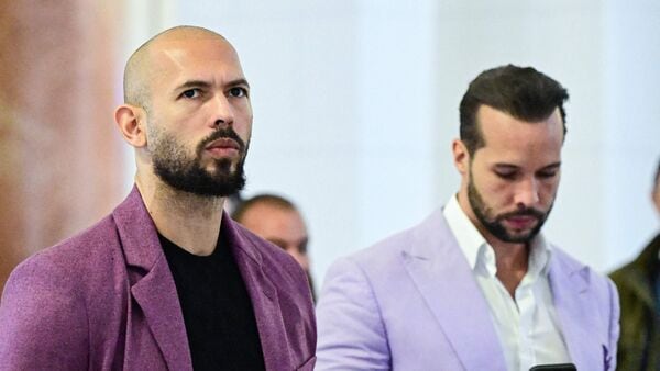 Latest news on July 19, 2026: (FILES) Andrew Tate (L) and his brother Tristan Tate are pictured inside The Court of Appeal in Bucharest, Romania, on December 10, 2024. Radical social media influencer Andrew Tate and his brother Tristan were arrested on July 18, 2026 in Miami, the US Marshals Service told AFP, with news outlet TMZ posting video of officers placing the men in custody. The UK Crown Prosecution Service said in a statement UK prosecutors will be seeking the brothers' extradition in relation to charges including rape, trafficking and assault. (Photo by Daniel MIHAILESCU / AFP)