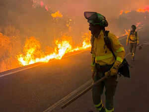 Firefighters battle one of Spain's biggest-ever wildfires during heat wave across the Mediterranean