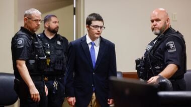 Colt Gray, the 16-year-old Apalachee High School shooting suspect, is led in by deputies for a plea hearing at Barrow County Superior Court in Winder, Ga., on Friday, July 24, 2026.