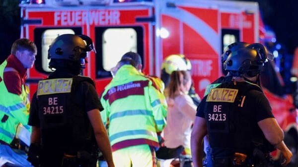 Latest news on July 26, 2026: Police officers walk, as emergency responders work on the site, after the annual Berlin's Christopher Street Day Pride parade was called off, after a car crashed into the crowd at Tiergarten park, leaving several people injured, in Berlin, Germany, July 25, 2026.  REUTERS/Christian Mang