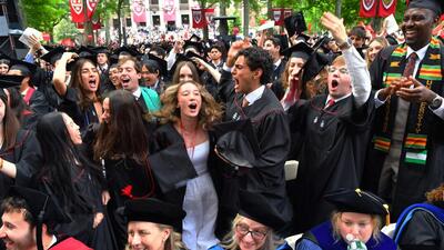 Harvard University graduates celebrate during commencement exercises on the school’s campus on May 28. (AP)