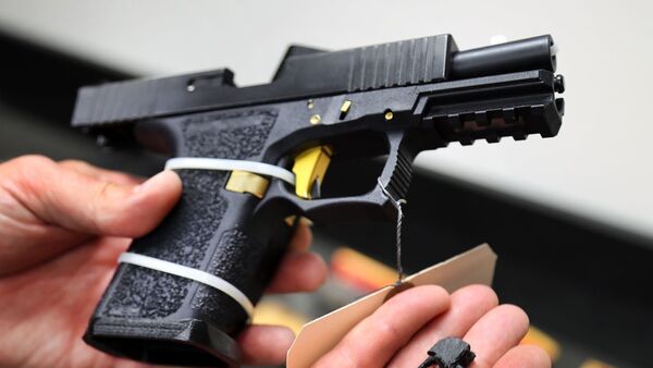 A machine-gun conversion device for a Glock handgun, known as a ‘switch,’ can be made with a 3-D printer. PHOTO: JOHN TLUMACKI/THE BOSTON GLOBE/GETTY IMAGES