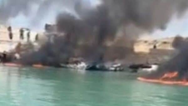 Smoke rises from boats on fire at a fishing pier in Banood, Bushehr Province, Iran, after a U.S. projectile struck the area around Iran's Bushehr nuclear power plant on Thursday, according to the deputy governor of Bushehr Province, in this screengrab from a video obtained from social media and released on July 9, 2026. SOCIAL MEDIA/via REUTERS