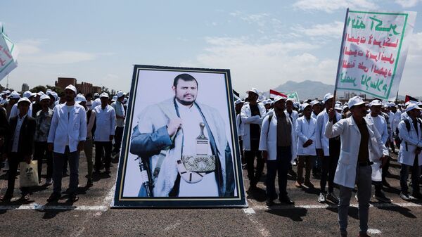 Students stand by a poster of Houthi leader Abdul-Malik al-Houthi as they parade at Sanaa University campus to show support for the Houthis amid an escalation with Saudi Arabia, in Sanaa, Yemen July 22, 2026. REUTERS/Khaled Abdullah