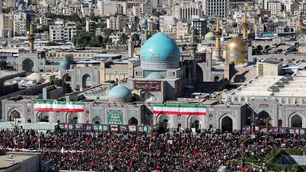 Mourners gather by Imam Reza shrine, on the day of the burial of Iran's late Supreme Leader Ayatollah Ali Khamenei, who was killed on February 28 in Israeli and US airstrikes, in a culmination of a mass funeral, in Mashhad, Iran, on 9 July 2026.