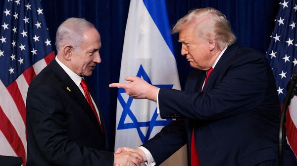 US President Donald Trump points his finger towards Israeli Prime Minister Benjamin Netanyahu as they shake hands during a press conference after meeting at Trump’s Mar-a-Lago club in Palm Beach, Florida.