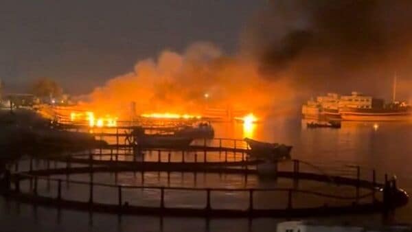 Smoke rises from a port, near Strait of Hormuz, following a U.S. strike in Kuhestak, Hormozgan Province, Iran, July 8, 2026,