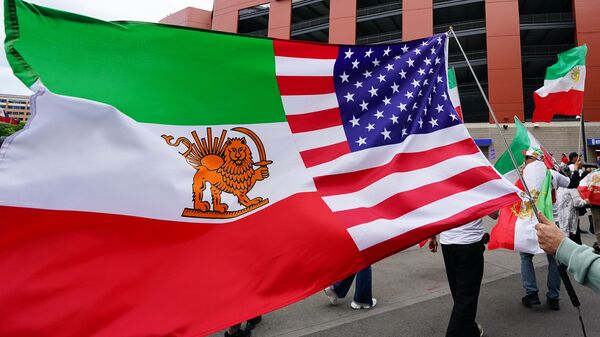 A man holds a US-Iran flag