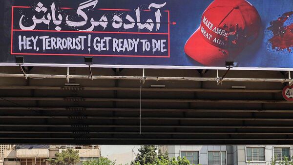 Latest news on July 23, 2026: An anti-US banner that reads 'Prepare to die' in Farsi in Tehran on July 19, 2026. (Photo by ATTA KENARE / AFP) /
