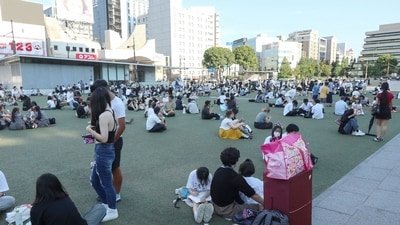 Japan earthquake: People wait in a park after evacuating buildings following a strong earthquake in Kumamoto City, Chuo Ward on July 28, 2026. A major earthquake collapsed buildings and sparked fires in Japan's southwest, Prime Minister Sanae Takaichi said, with broadcaster NHK saying that at least 50 people were taken to hospital. (Photo by JIJI Press / AFP) / Japan OUT (AFP)