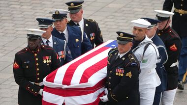 An Armed Forces Body Bearer Team carries the casket of late Republican Senator Lindsey Graham during a ceremony for late Republican Senator Lindsey Graham at the US Capitol in Washington, DC, US, on Tuesday, July 28, 2026. Photographer: Mark Schiefelbein/AP Photo/Bloomberg