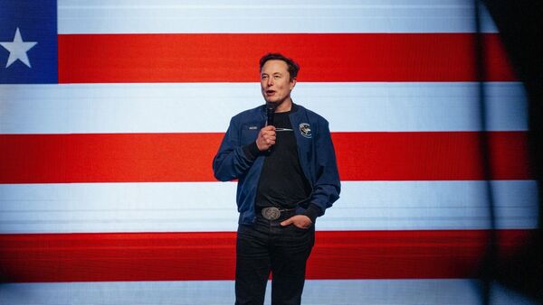 Elon Musk, chief executive officer of Tesla Inc., speaks during an America PAC town hall ahead of the Wisconsin Supreme Court election at the KI Convention Center in Green Bay, Wisconsin, US, on Sunday, March 30, 2025. Photographer: Jamie Kelter Davis/Bloomberg
