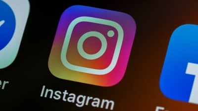 Instagram, Facebook, and Messenger logos are seen on the screen. (Unsplash)