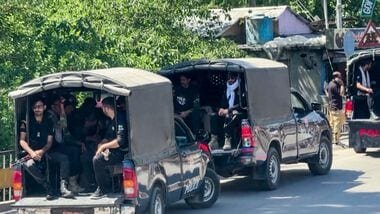 File image of police officials patrol an area amid the ongoing violence in PoK