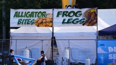 Vendors clean up the day after a shooting at Seattle Center during the Bite of Seattle food festival, Monday, July 27, 2026, in Seattle. (AP Photo/Lindsey Wasson) (AP Photo/Lindsey Wasson)