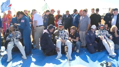 NASA astronaut Christopher Williams, Roscosmos cosmonauts Sergey Kud-Sverchkov and Sergei Mikaev rest after returning from the International Space Station (ISS) aboard the Soyuz MS-28 space capsule following their landing in a remote area near Zhezkazgan, Kazakhstan, July 26, 2026, (via REUTERS)