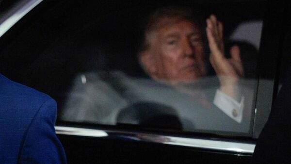 A U.S. Secret Service Agent keeps watch as President Donald Trump waves from his presidential limousine The Beast while leaving the Salute to America Celebration on the National Mall on July 05, 2026 in Washington, DC. Chip Somodevilla/Getty Images/AFP