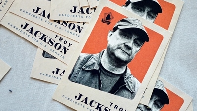 Camapign cards for Troy Jackson, Democratic candidate for U.S. Senate, are displayed in the lobby of the Maine Democratic Nominating Convention, Saturday, July 25, 2026. (AP Photo/Robert F. Bukaty)