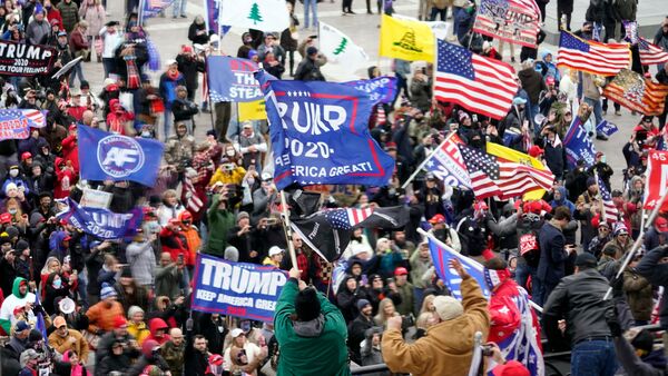 FILE - Violent protesters gather outside the U.S. Capitol, Jan 6, 2021.