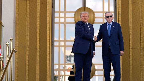President Donald Trump, left, shakes hands with Turkish President Recep Tayyip Erdogan as he arrives at the Bestepe Presidential Palace during a formal welcome for the NATO summit in Ankara, Turkey, on Tuesday, 7 July 2026. (AP Photo/Emral Gureh)