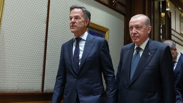 In this handout photo released by Turkish Presidency, Turkish President Recep Tayyip Erdogan, right, and NATO Secretary General Mark Rutte walk during their meeting ahead of the NATO Summit, in Ankara, Monday, July 6, 2026. (Turkish Presidency via AP)