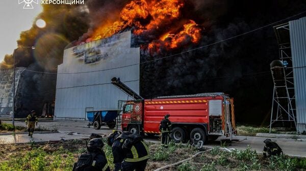 Firefighters work at the site of one of the biggest Ukrainian poultry farms which was hit by a Russian air strike on Friday evening in the town of Chornobaivka, amid Russia's attack on Ukraine, in Kherson region, Ukraine, in this handout picture released July 4, 2026. Press service of the State Emergency Service of Ukraine in Kherson region/Handout via REUTERS