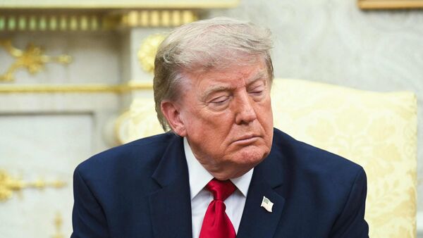 US President Donald Trump listens during a meeting with Prime Minister of Iraq Ali al-Zaidi in the Oval Office of the White House in Washington, DC, on July 14, 2026. (Photo by SAUL LOEB / AFP)