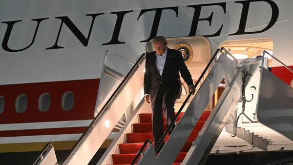 US President Donald Trump disembarks from Air Force One upon arrival at Joint Base Andrews, Maryland on July 9, 2026. Trump is returning from the NATO Summit in Turkey. (Photo by SAUL LOEB / AFP)