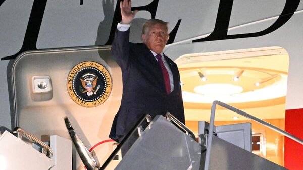US President Donald Trump waves as he boards Air Force One at Ellsworth Air Force Base, South Dakota on July 3, 2026. (Photo by Mandel NGAN / AFP)