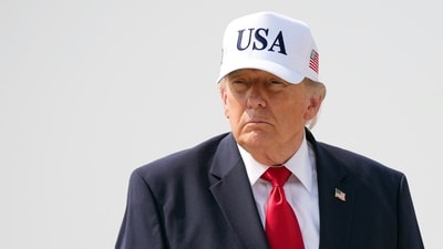 President Donald Trump's latest financial disclosure report reveals his earnings in millions from crypto, real estate holdings, and merchandise, raising concerns about presidential gains (Getty Images via AFP)