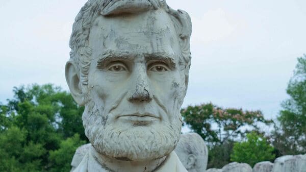 Giant, crumbling concrete bust of former US President Abraham Lincoln at The Presidents Heads in Williamsburg, Virginia.