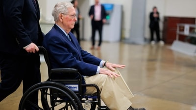 Amid growing health concerns for hospitalized Senator Mitch McConnell, Governor Andy Beshear has requested a status update. Beshear stresses the need for transparency regarding public officials' health to prevent speculation. (Getty Images via AFP)