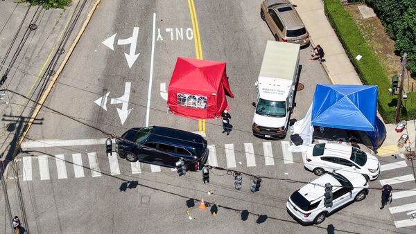 A drone view shows members of law enforcement working at the scene of a shooting involving U.S. Immigration and Customs Enforcement (ICE) in Biddeford, Maine, U.S. July 13, 2026. REUTERS/CJ Gunther