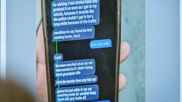 A photograph which prosecutors say shows a text message exchange between Tyler Robinson, who is accused in the fatal shooting of Charlie Kirk, and Lance Twiggs, is shown during a preliminary hearing at the 4th District Court in Provo, Utah, U.S., July 9, 2026.    Spenser Heaps/Pool via REUTERS