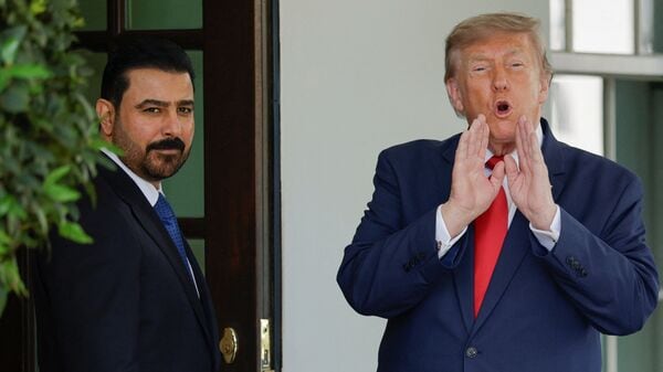 U.S. President Donald Trump gestures as he greets Iraqi Prime Minister Ali al-Zaidi outside the West Wing at the White House in Washington,