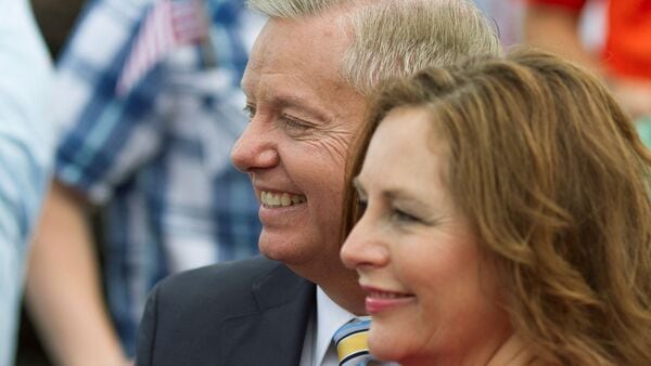 FILE PHOTO: Then Republican presidential candidate U.S. Senator Lindsey Graham stands with his sister Darline Graham Nordone after formally announcing his campaign for the 2016 Republican presidential nomination in his hometown Central, South Carolina June 1, 2015. REUTERS/Christopher Aluka Berry/File Photo
