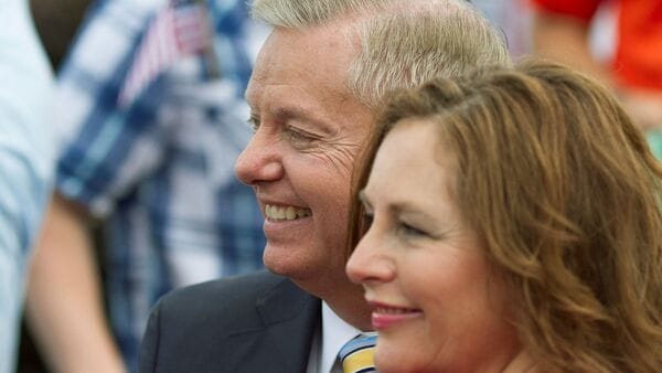 FILE PHOTO: hen Republican presidential candidate U.S. Senator Lindsey Graham stands with his sister Darline Graham Nordone after formally announcing his campaign for the 2016 Republican presidential nomination in his hometown Central, South Carolina June 1, 2015.  REUTERS/Christopher Aluka Berry/File Photo