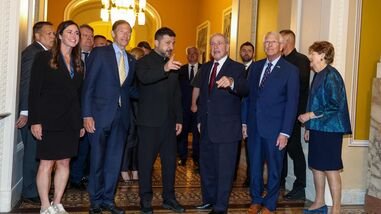 (L-R) Sen. Katie Britt (R-Ala.), Sen. Richard Blumenthal (D-CT), Ukraine President Volodymyr Zelensky, Sen. James Risch (R-ID), Sen. Roger Wicker (R-MS) and Sen. Jeanne Shaheen (D-NH) chat before they head to a closed door meeting at the US Capitol on July 28, 2026 in Washington, DC. President Zelenskyy was in the United States to attend the funeral service for the late Sen. Lindsey Graham.