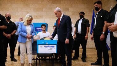 Israeli Prime Minister Benjamin Netanyahu, right, and his wife, Sara, cast their ballots in the Likud party primary elections ahead of Israel's general election in October, in Jerusalem, Monday, Aug. 17, 2026. (AP Photo/Ohad Zwigenberg, Pool)