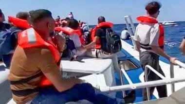 Latest news on August 31, 2026: Passengers await rescue at sea after a ferry sank off Kyrenia, Northern Cyprus, on August 30, 2026. (Photo by DHA (Demiroren News Agency) / AFP- screen grab image taken from UGC handout video courtesy of DHA)
