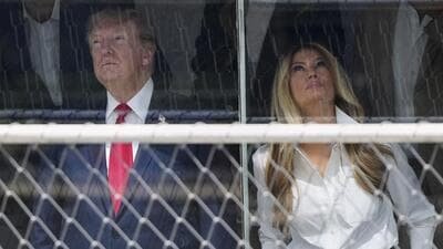 Donald Trump and first lady Melania Trump attend the IndyCar Freedom 250 Grand Prix auto race in Washington DC on Sunday. (AP)