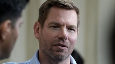 FILE - Eric Swalwell talks with reporters after holding a town hall meeting in Sacramento, Calif., April 7, 2026. (AP Photo/Rich Pedroncelli, File)