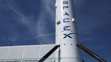 (FILES) A SpaceX Falcon 9 rocket is displayed outside a Space Exploration Technologies Corp. facility in Hawthorne, California on March 26, 2026. (Photo by Patrick T. Fallon / AFP) - Image for representational purpose)